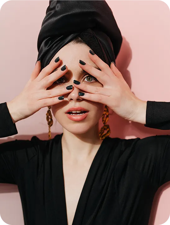 adorable caucasian girl turban covering face with hands studio shot fashionable woman isolated pink background